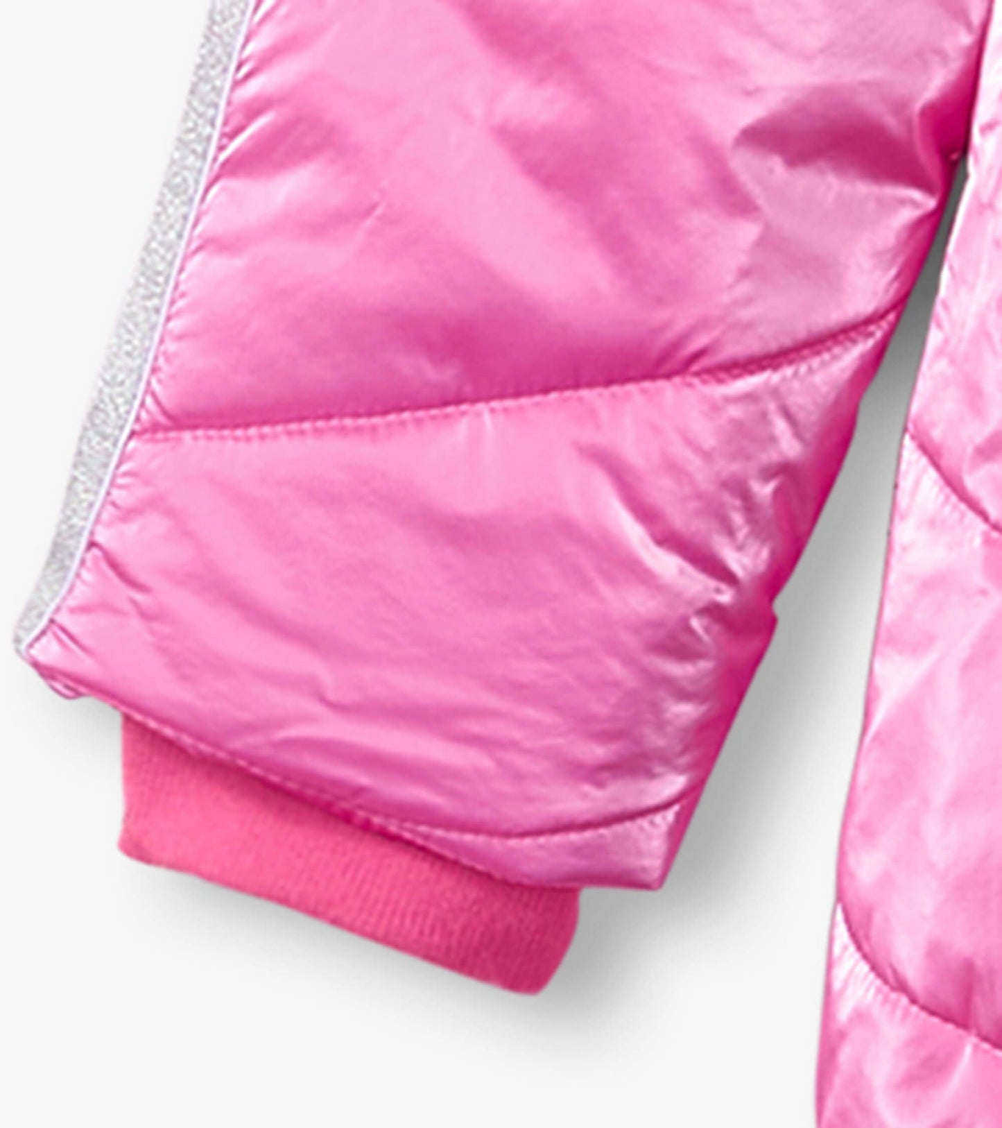 Bright pink puffer jacket with a shiny finish and ribbed cuffs, designed for kids.