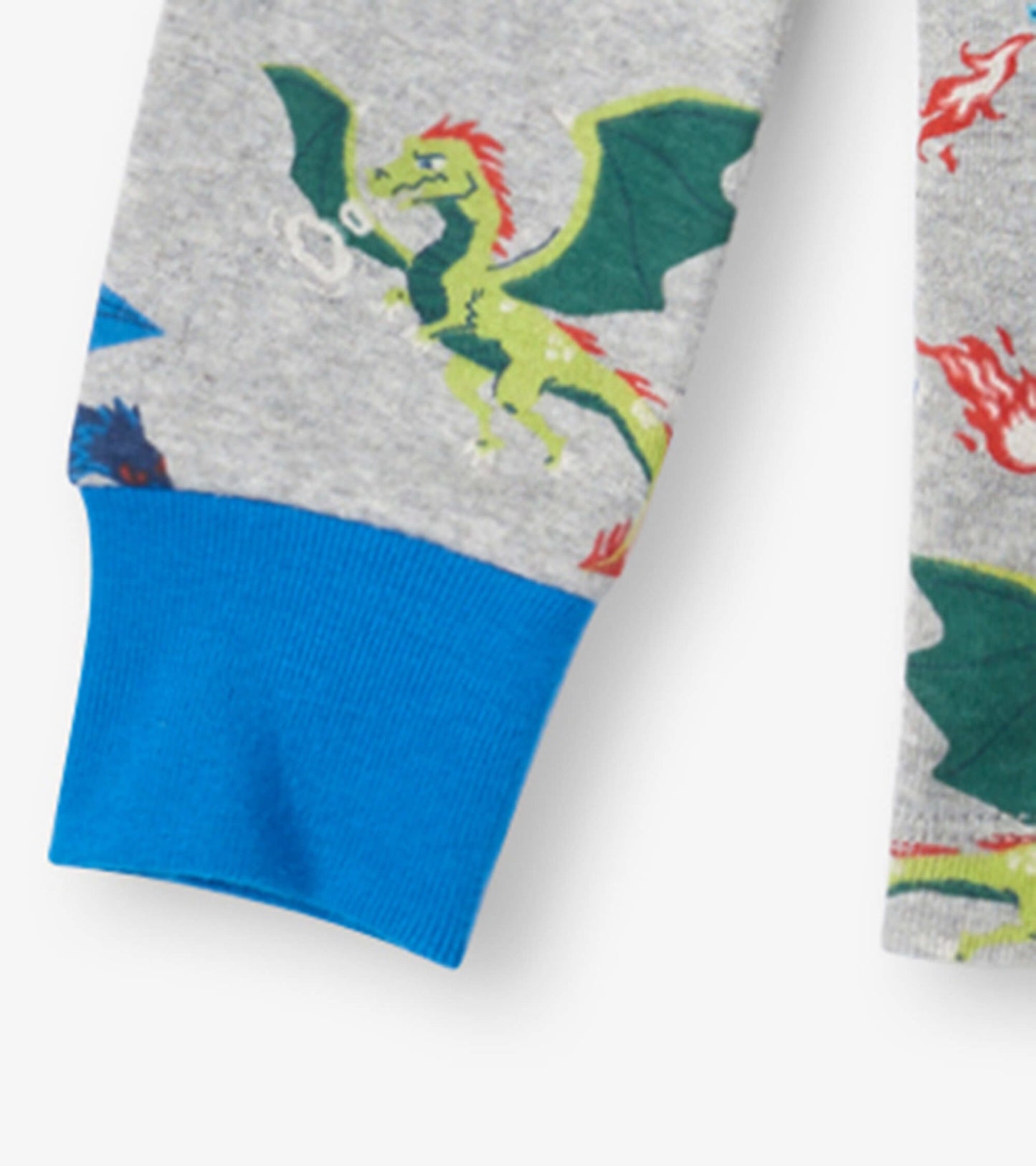 Gray organic cotton pajama set featuring colorful dragon and fire patterns, with blue cuffs on the sleeves.
