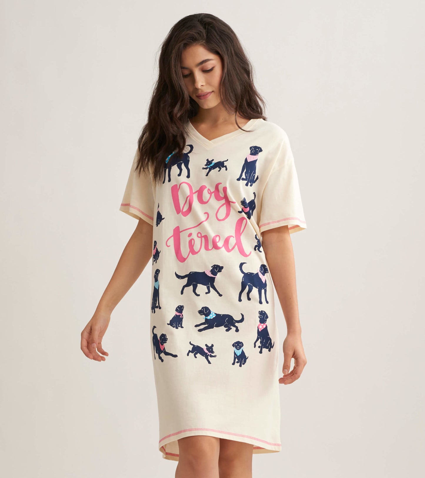 Cream sleepshirt featuring a playful dog print and "Dog tired" text, with a V-neck and short sleeves.