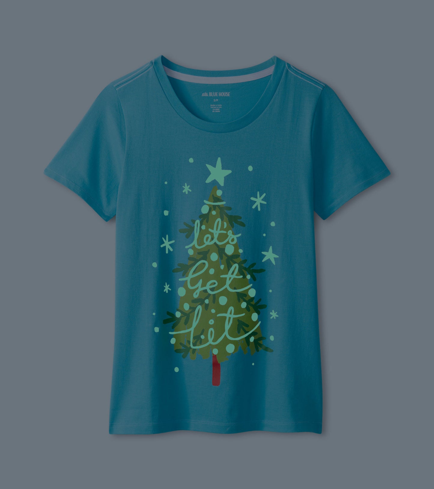 Teal short sleeve t-shirt featuring a graphic of a Christmas tree with stars and text design.