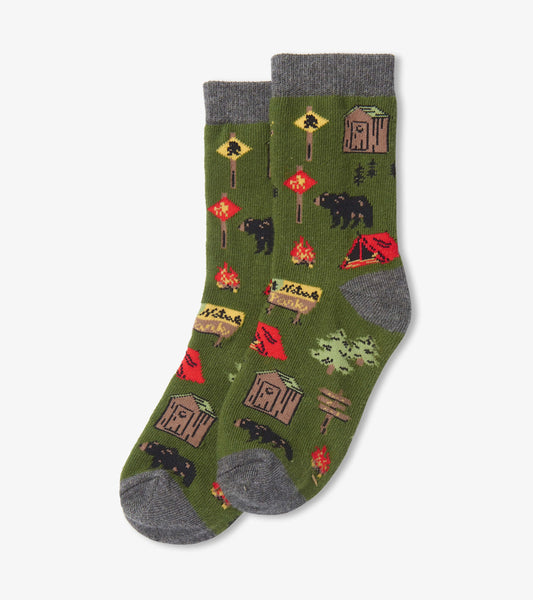 Green crew socks featuring camping-themed patterns, including bears, tents, and signs, with a gray cuff.
