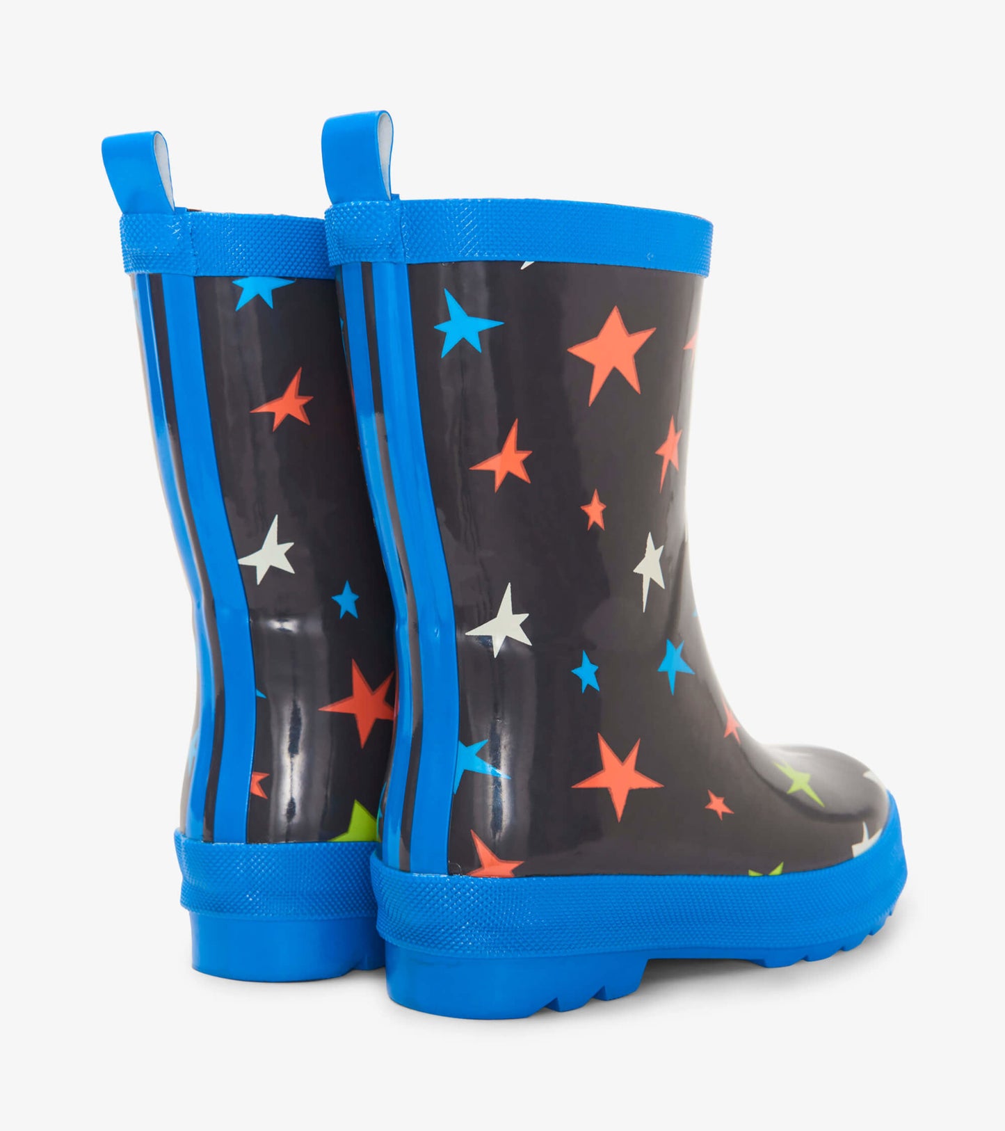 Shiny black rain boots with colorful star patterns and blue accents, featuring a sturdy sole and pull tabs for easy wear.