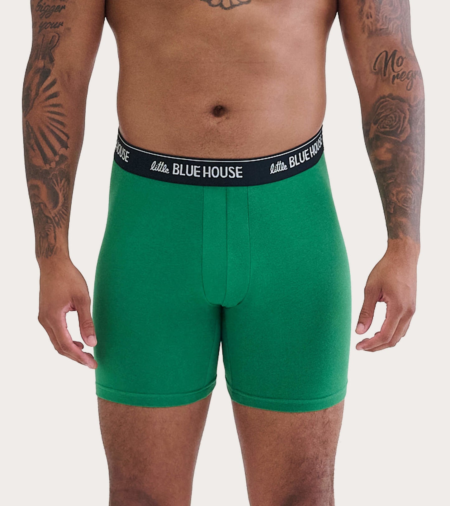 Green men's boxer briefs with a black waistband, featuring a snug fit and a smooth fabric texture.
