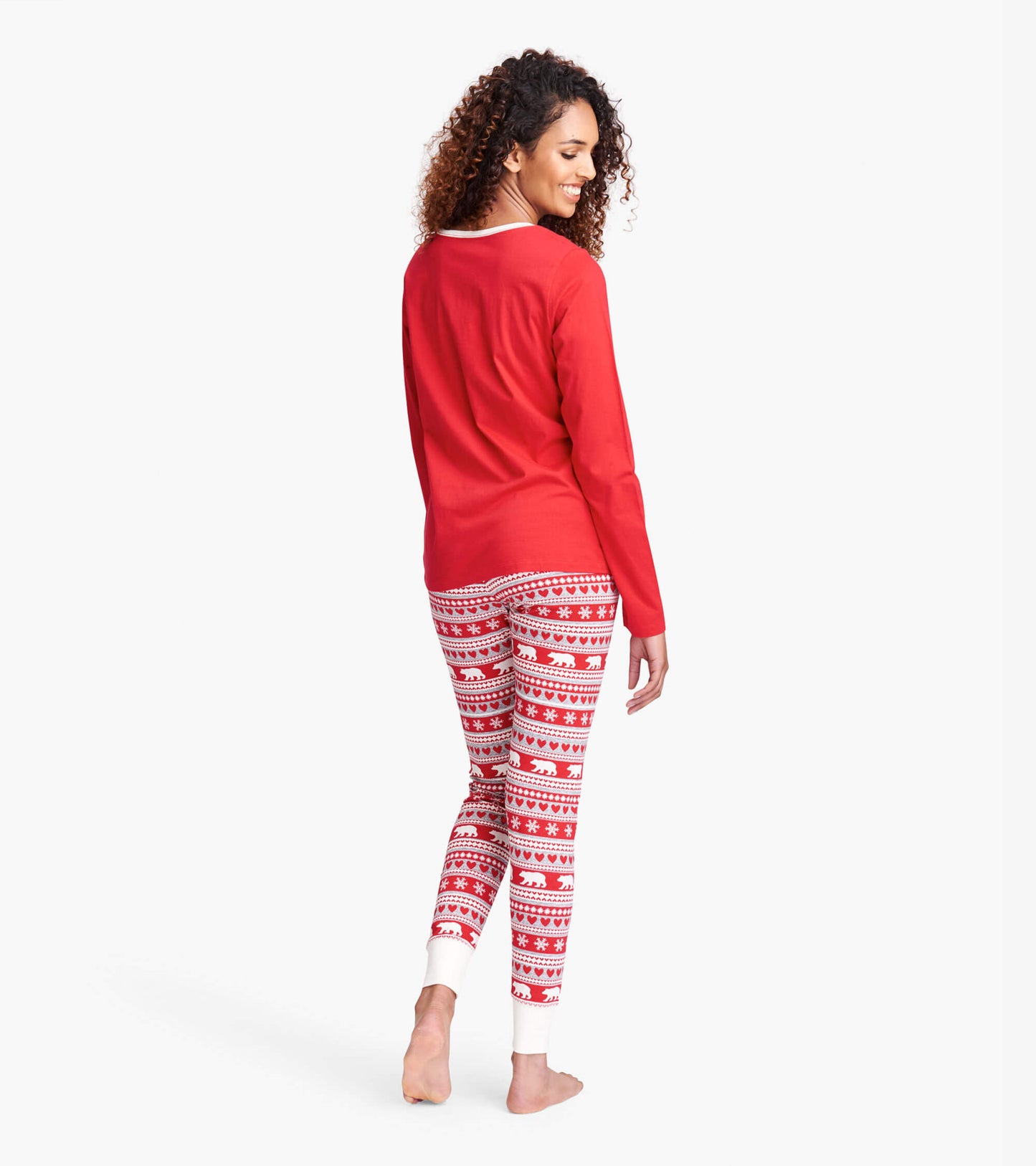Red sleep leggings featuring a Fair Isle pattern with bears and snowflakes, designed for comfort and relaxation.