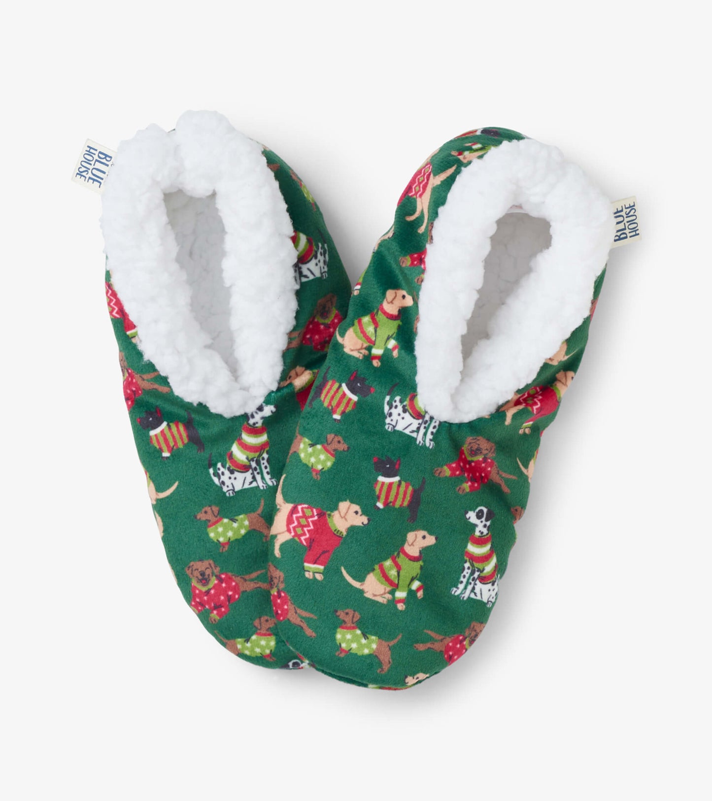 Green slippers with a cozy white lining, featuring a festive dog pattern in Christmas attire.