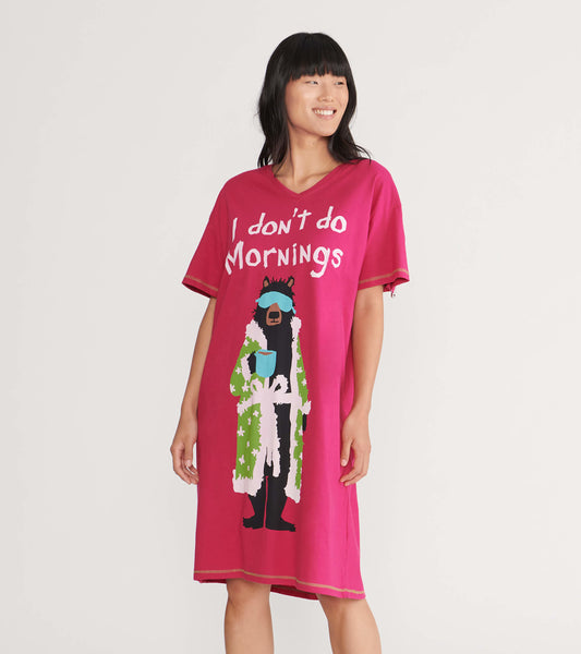 Pink women's sleepshirt featuring a bear graphic in a robe, with the text "I don't do Mornings" in white.