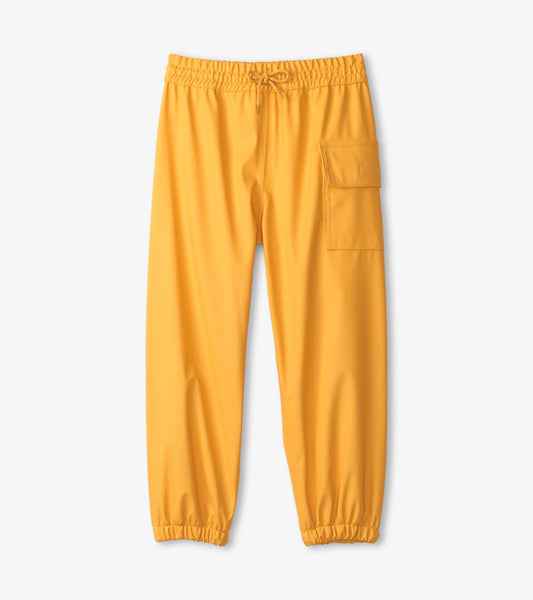 Yellow waterproof kids' rain pants with an elastic waistband and side pocket. Suitable for outdoor play in wet weather.