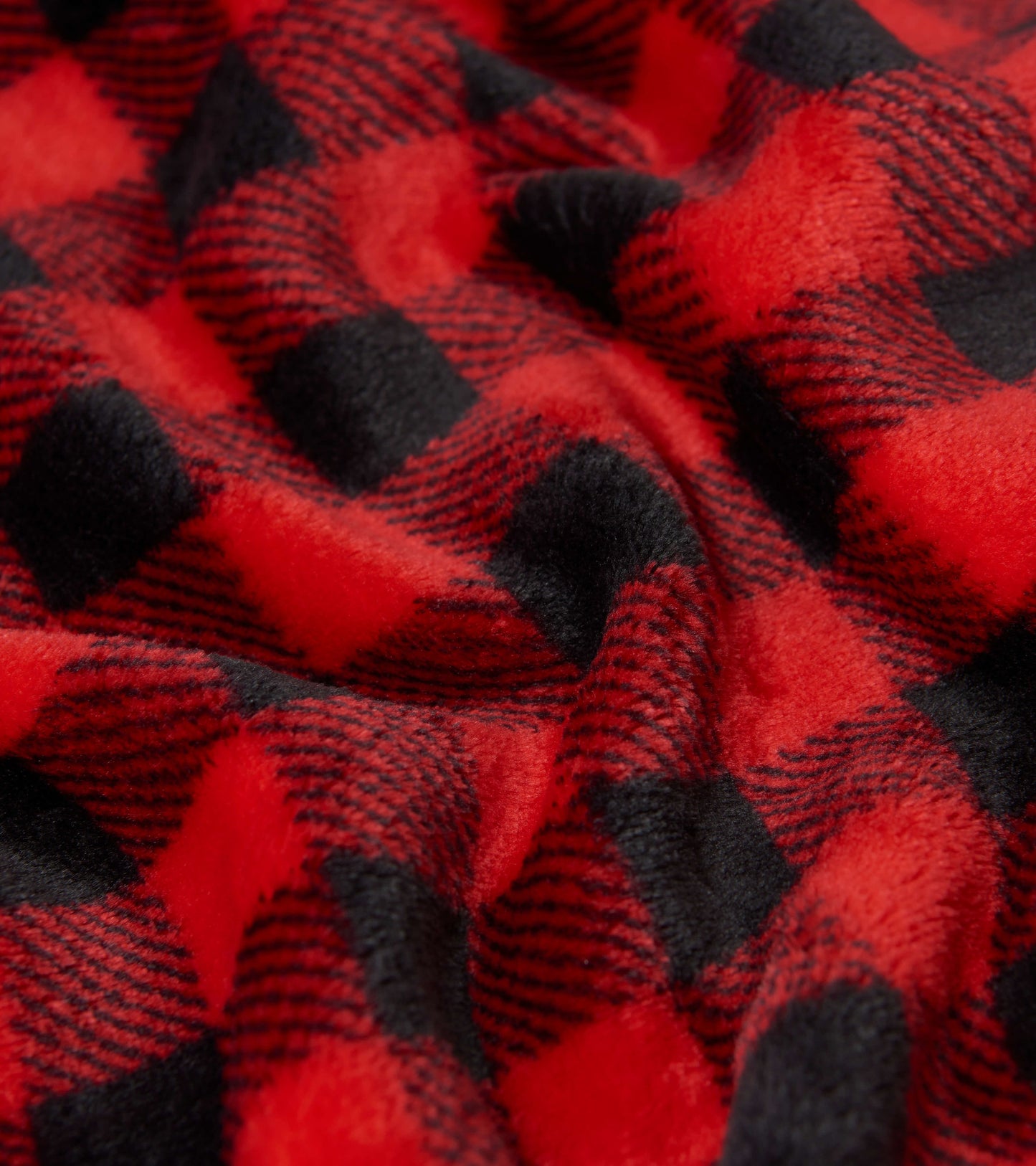 Red and black buffalo plaid fleece blanket with a soft, cozy texture, ideal for warmth and comfort.