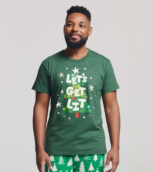 Green short-sleeve t-shirt featuring a festive Christmas tree graphic with text, perfect for holiday celebrations.