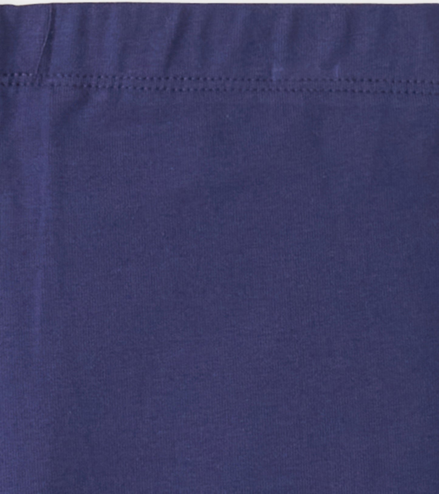 Navy bike shorts made from soft, stretchy fabric, featuring an elastic waistband for comfort and ease of movement.