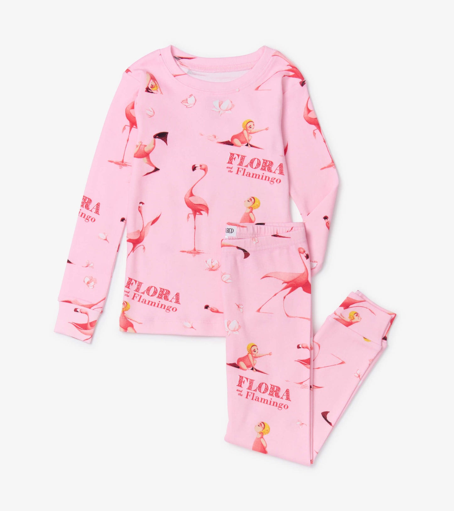 Pink long-sleeve pajama set featuring flamingo and girl illustrations, with matching pants. Soft, comfortable fabric.