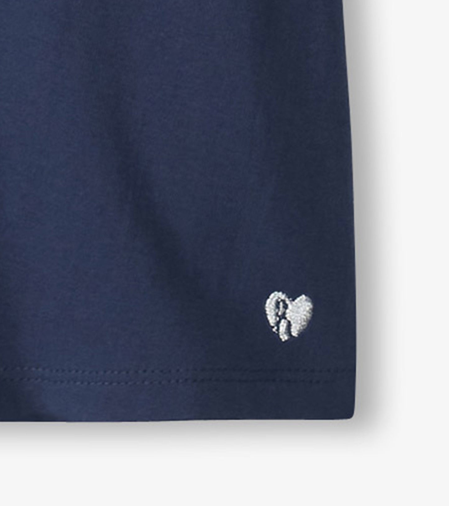 Navy blue short-sleeve tee with twisted sleeves and a small embroidered heart detail.