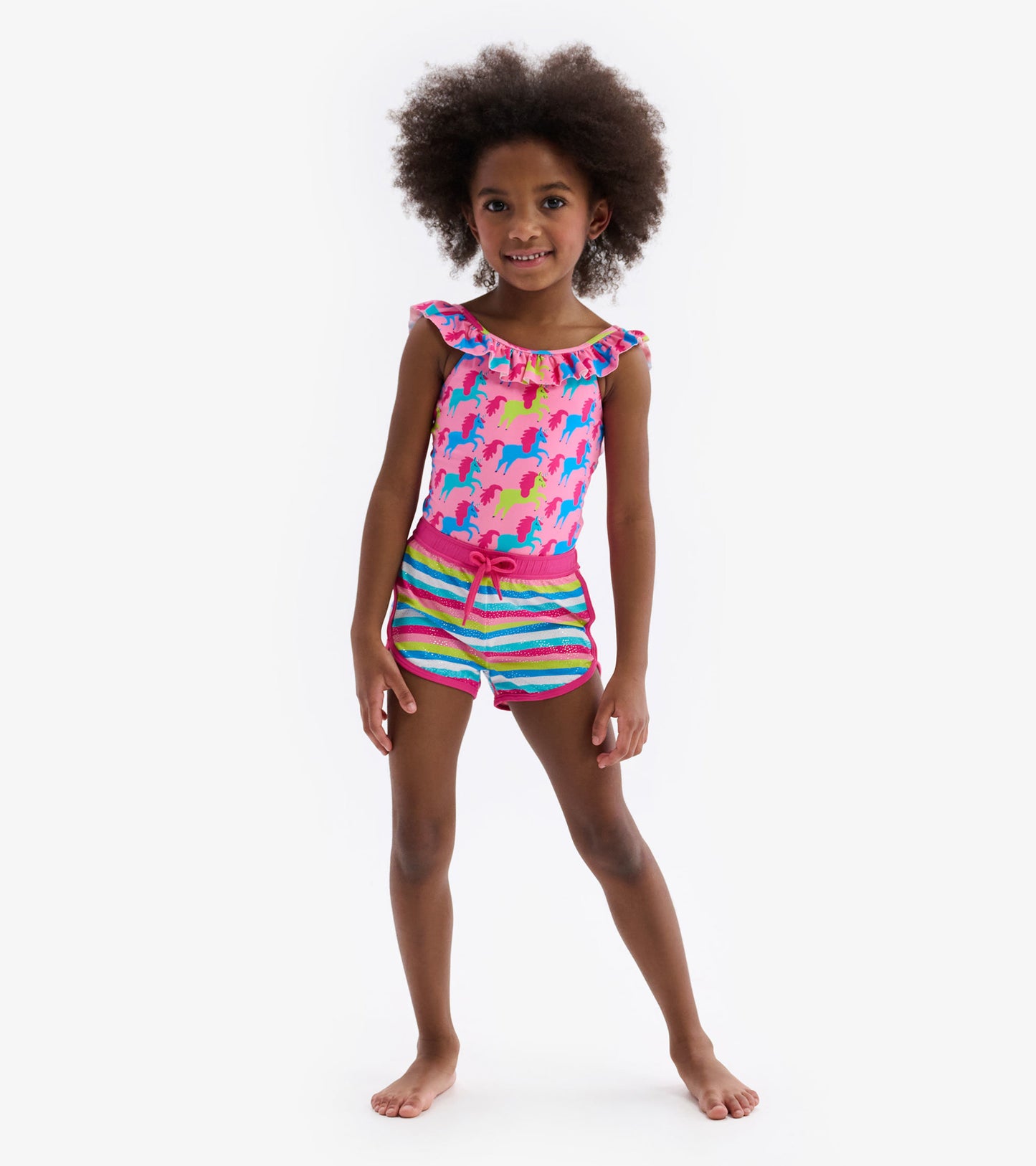 Colorful swim shorts featuring rainbow stripes and a drawstring waist, perfect for beach or pool activities.