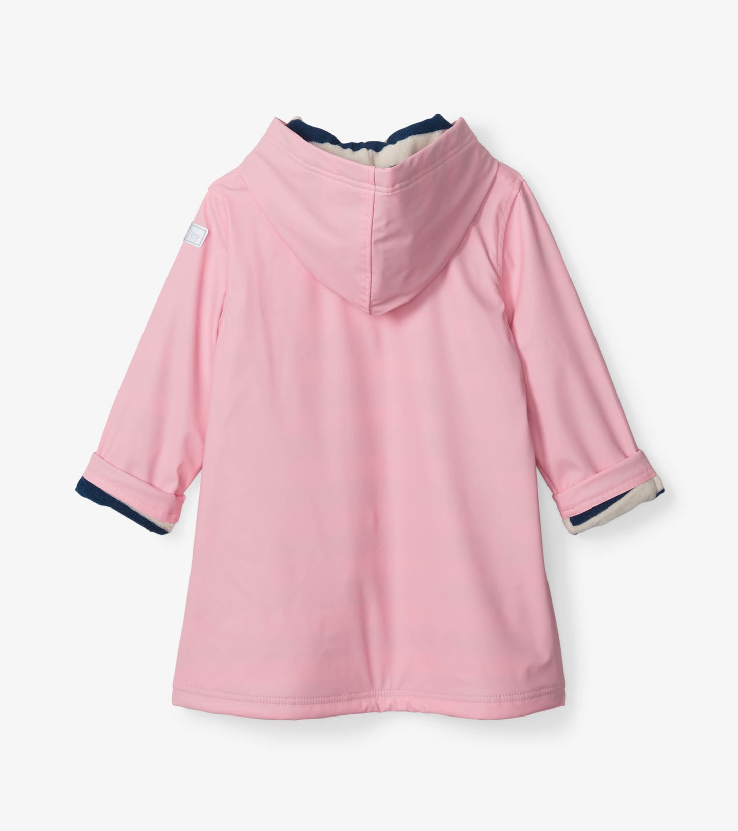 Pink rain jacket with a navy hood and cuffs, featuring a button-up design and long sleeves.