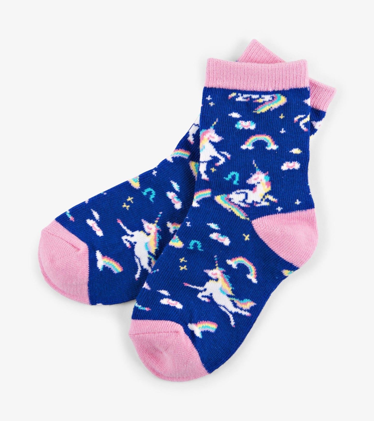 Blue crew socks featuring colorful unicorns, rainbows, and clouds with pink cuffs and toes, suitable for kids ages 2-7.