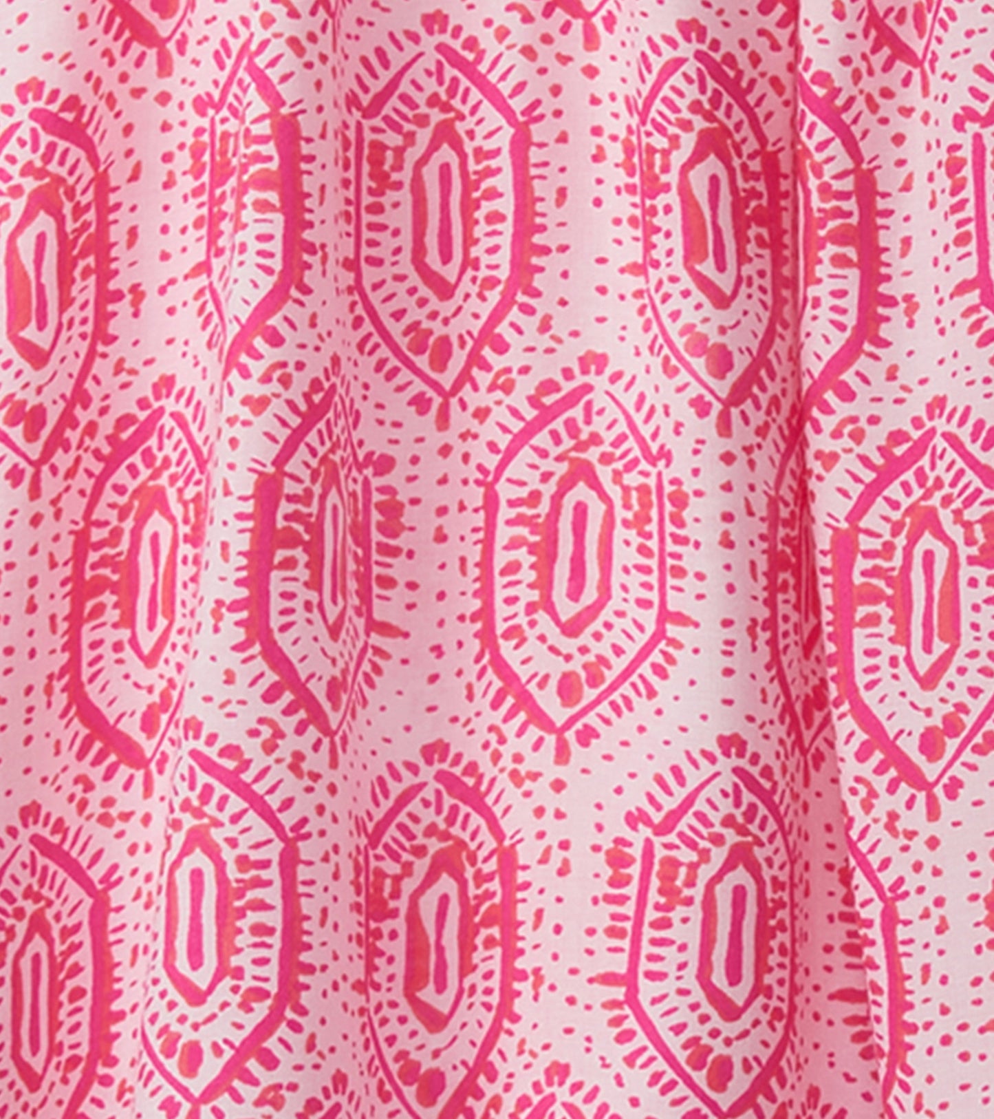 Pink dress featuring a geo mosaic pattern with diamond shapes and dotted accents, suitable for casual wear.