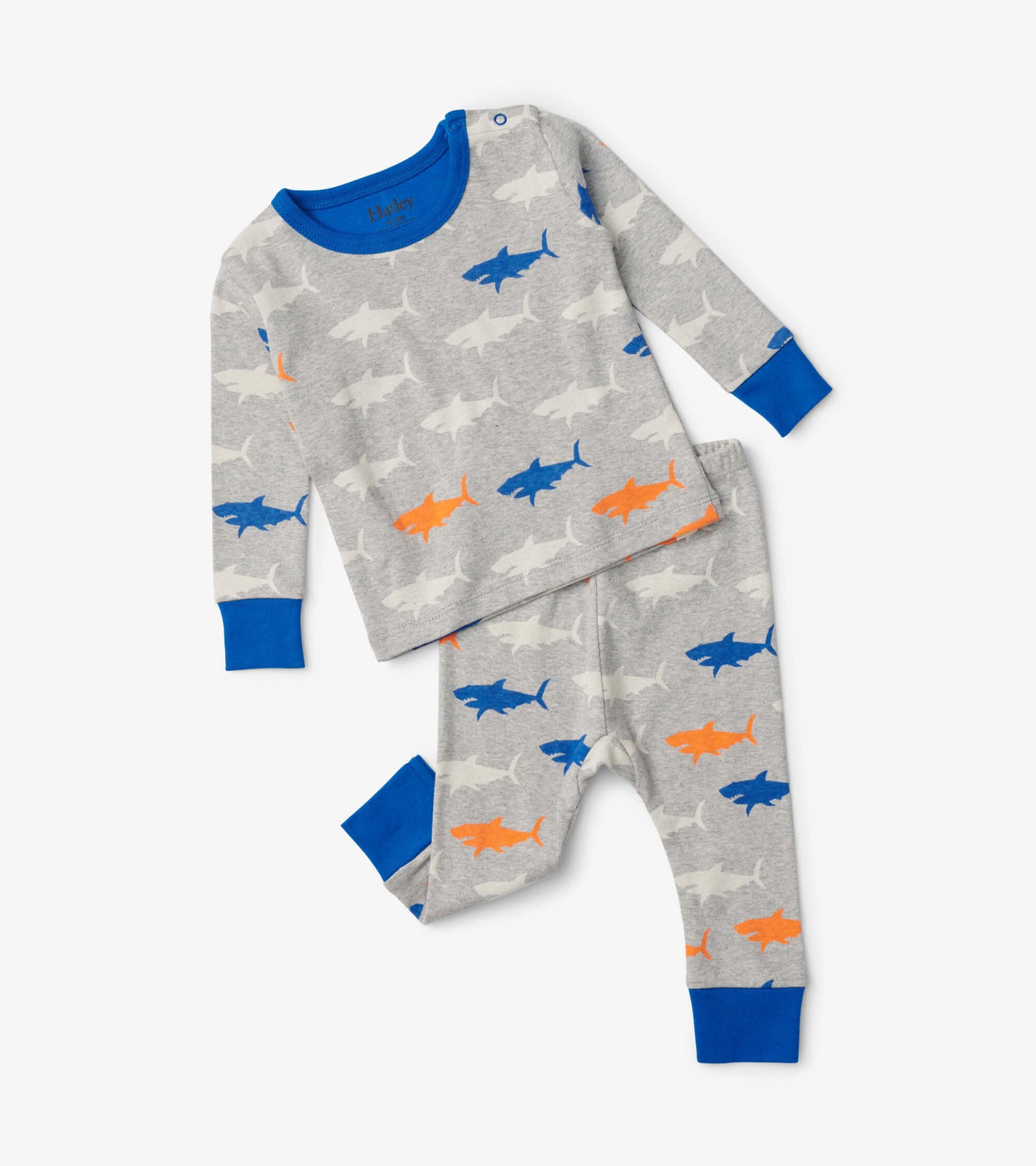 Gray baby pajama set featuring colorful shark patterns, with a long-sleeve top and matching pants, accented in blue.