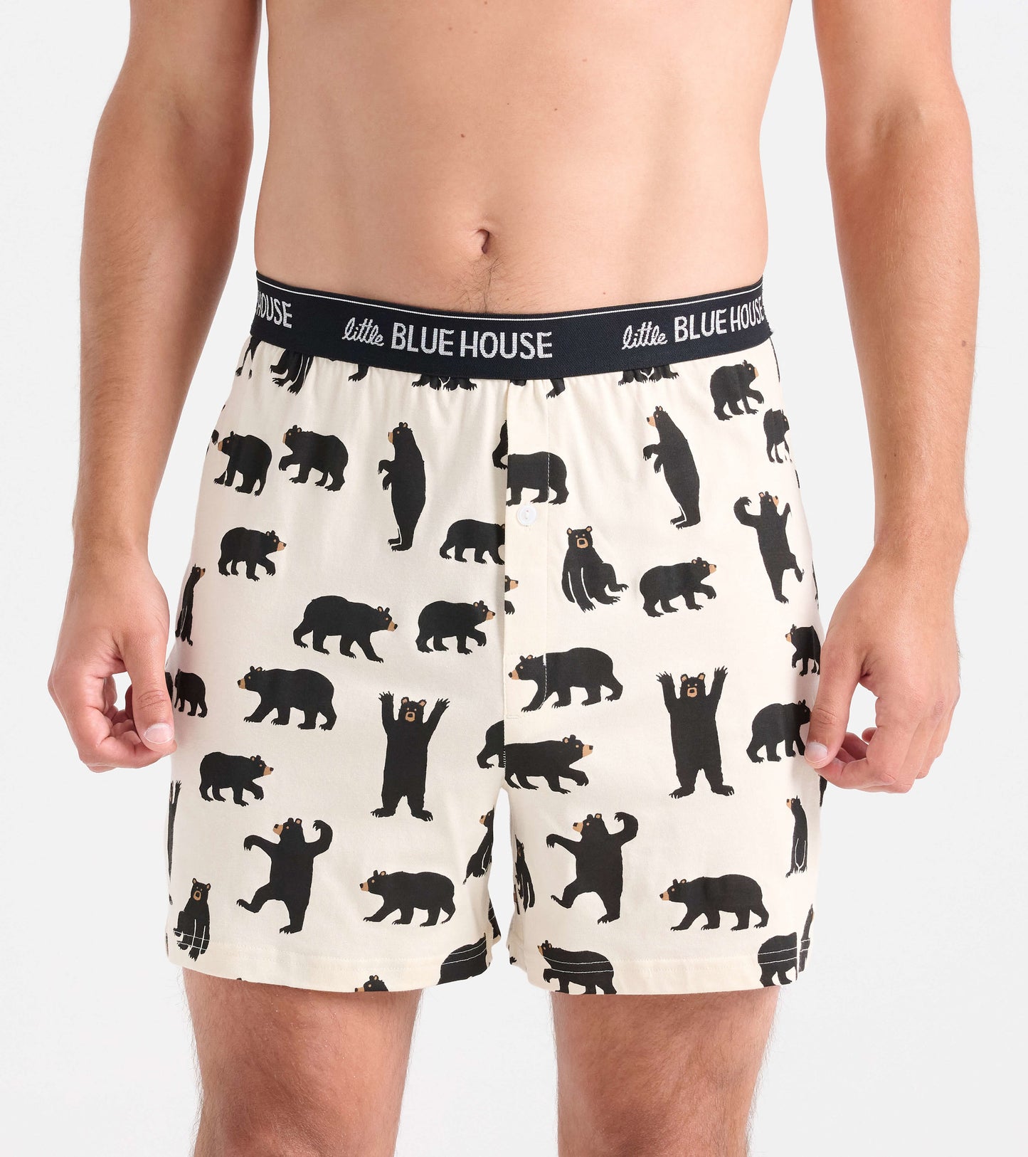 Men's boxer shorts featuring a playful black bear pattern on a cream background with an elastic waistband.