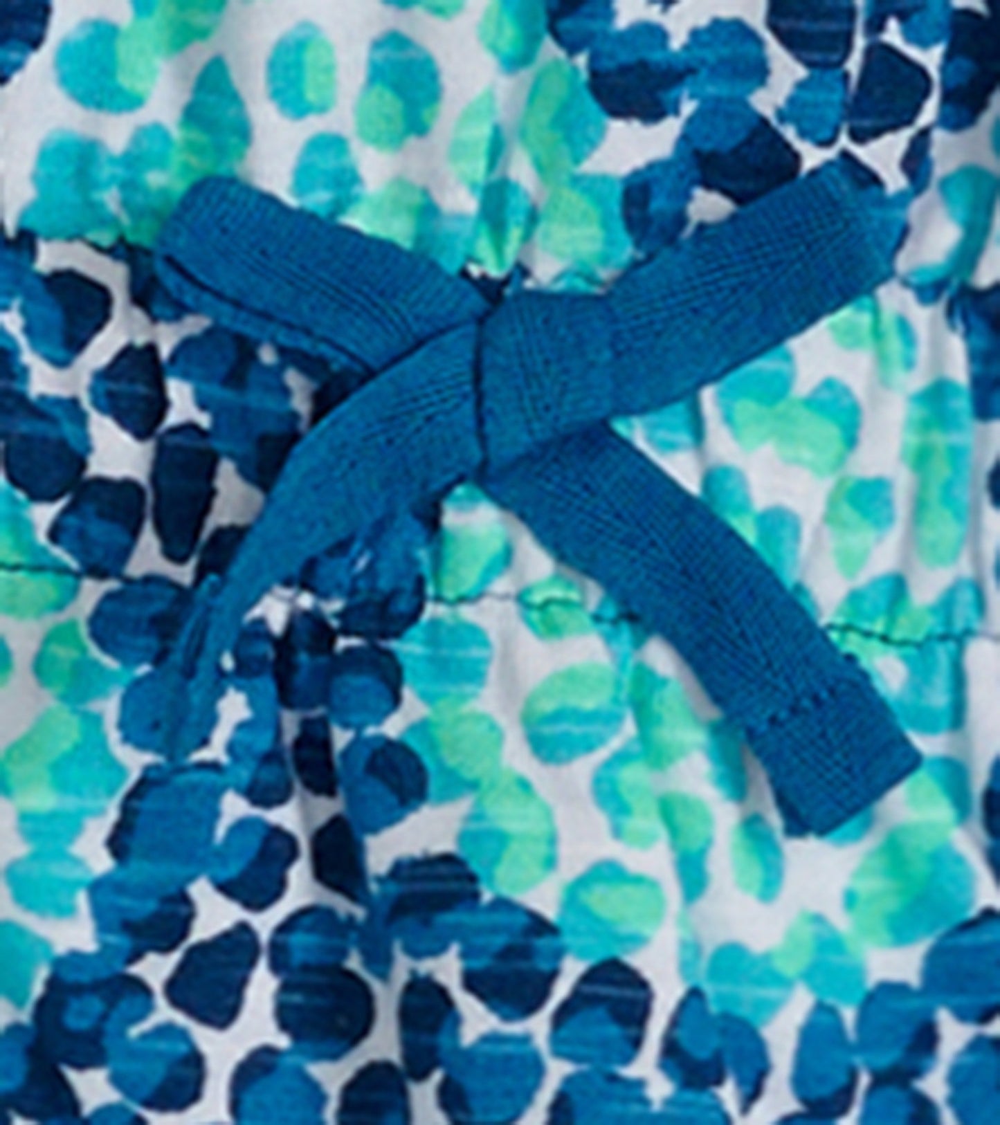 Blue and green patterned t-shirt dress with a tie waist detail, suitable for girls.