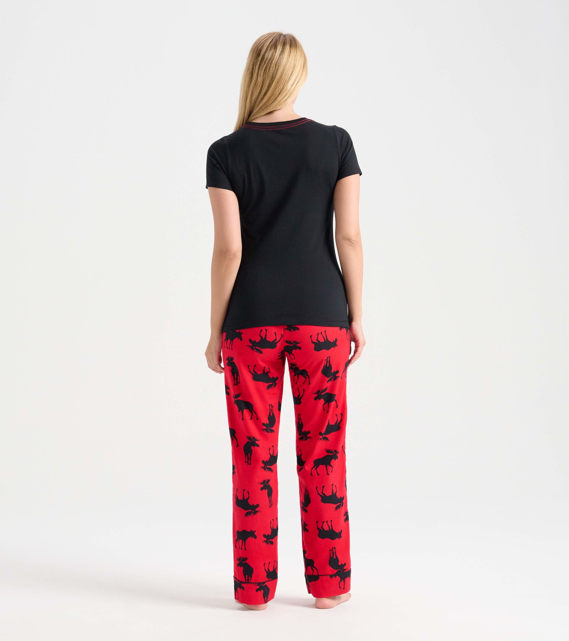Black short-sleeve pajama t-shirt paired with red pants featuring black moose patterns, viewed from the back.