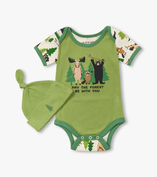 Green baby bodysuit with animal graphics and matching hat, featuring short sleeves and snap closures at the bottom.