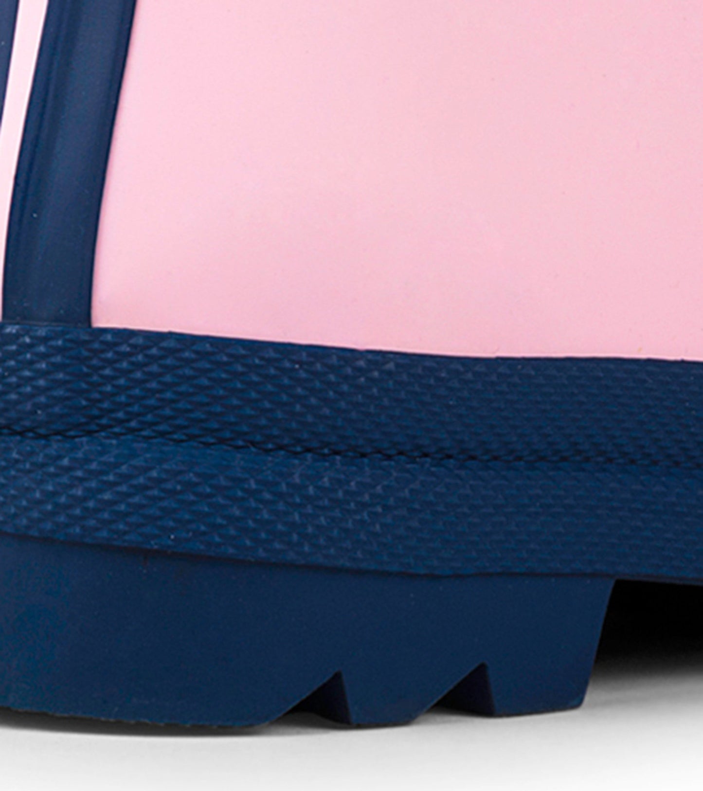 Pink and navy matte rain boots with a textured sole, designed for kids.