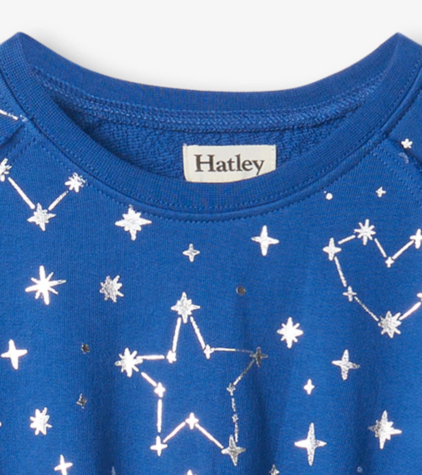 Blue terry dress featuring silver constellation patterns and a round neckline.