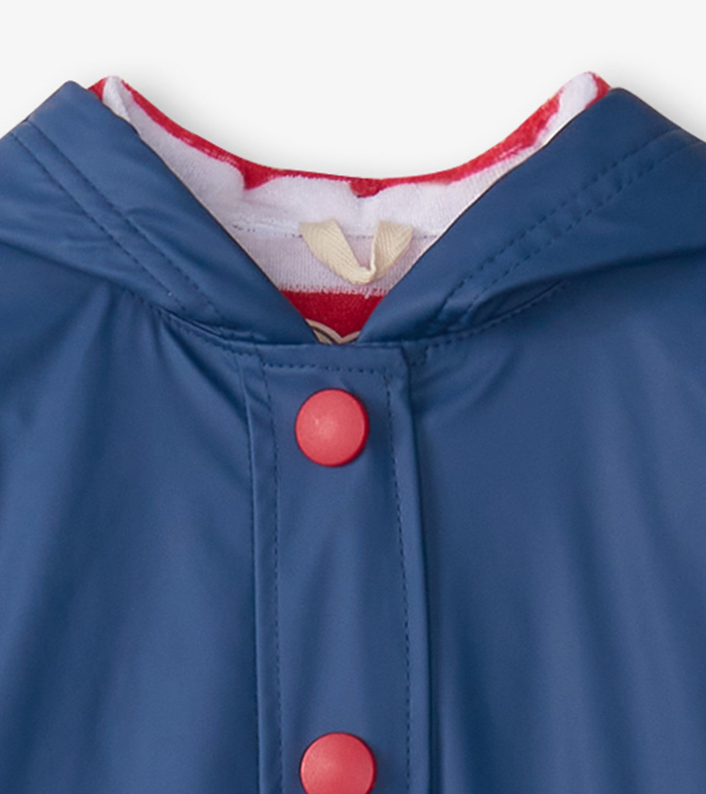 Navy rain jacket with red buttons and a hood, featuring a soft red and white lining.