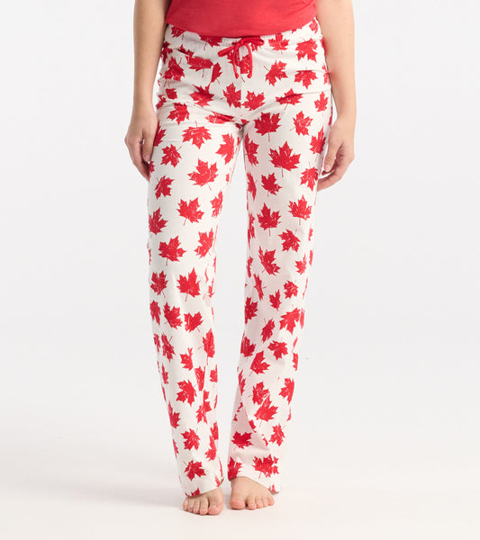 White cotton pajama pants with a red maple leaf pattern, featuring an elastic waistband and drawstring.