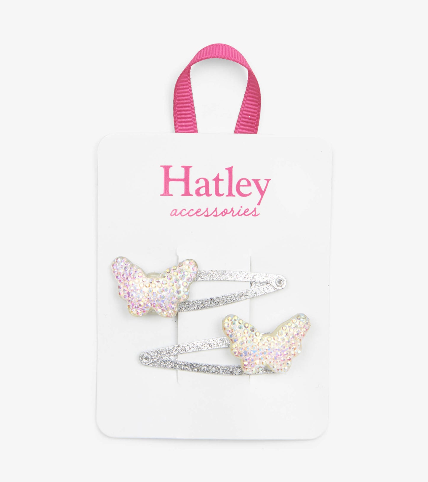 Two sparkling butterfly snap clips with iridescent wings and silver metal bases on a display card.