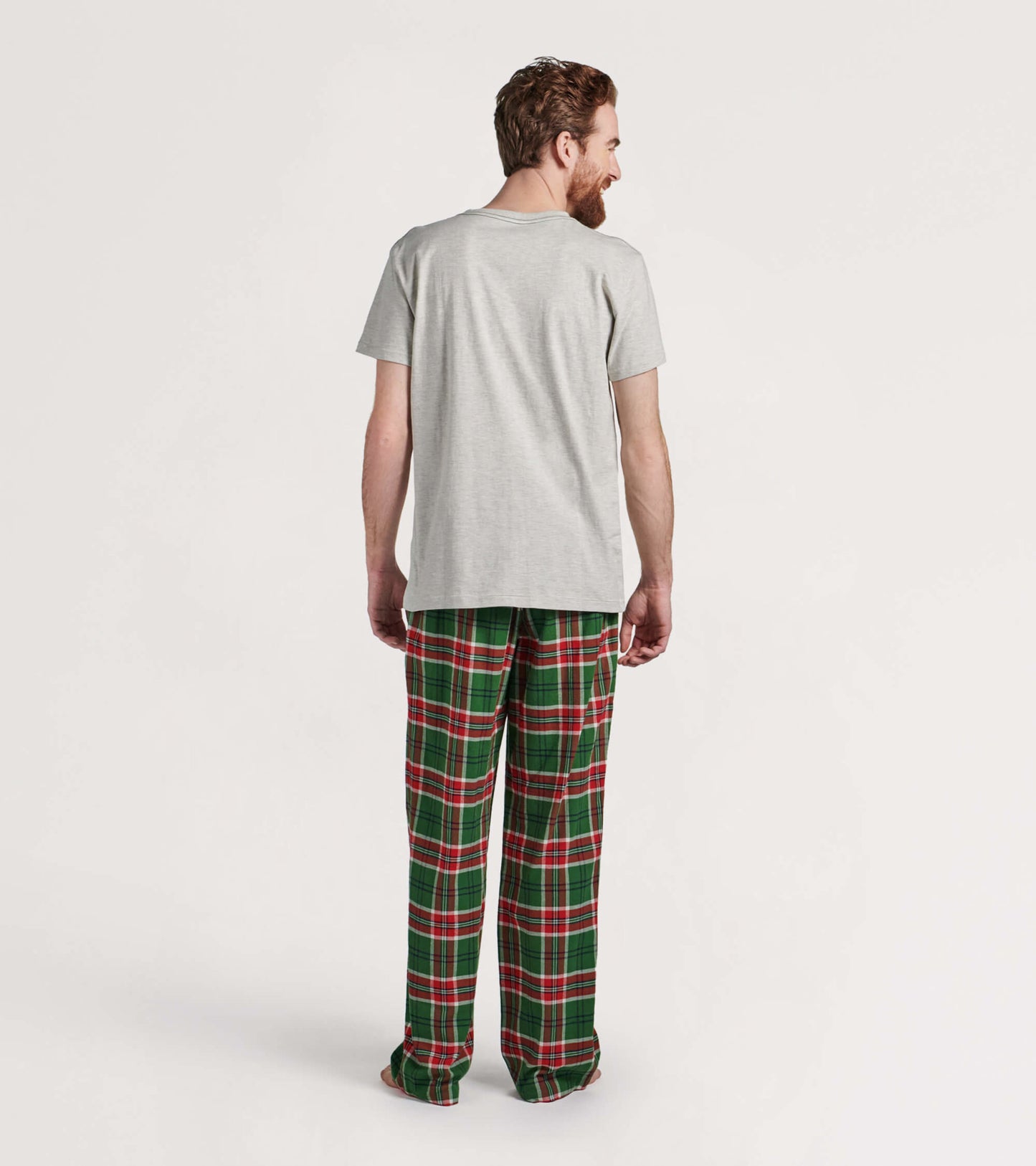 Men's flannel pajama pants featuring a green and red plaid pattern, shown from the back.