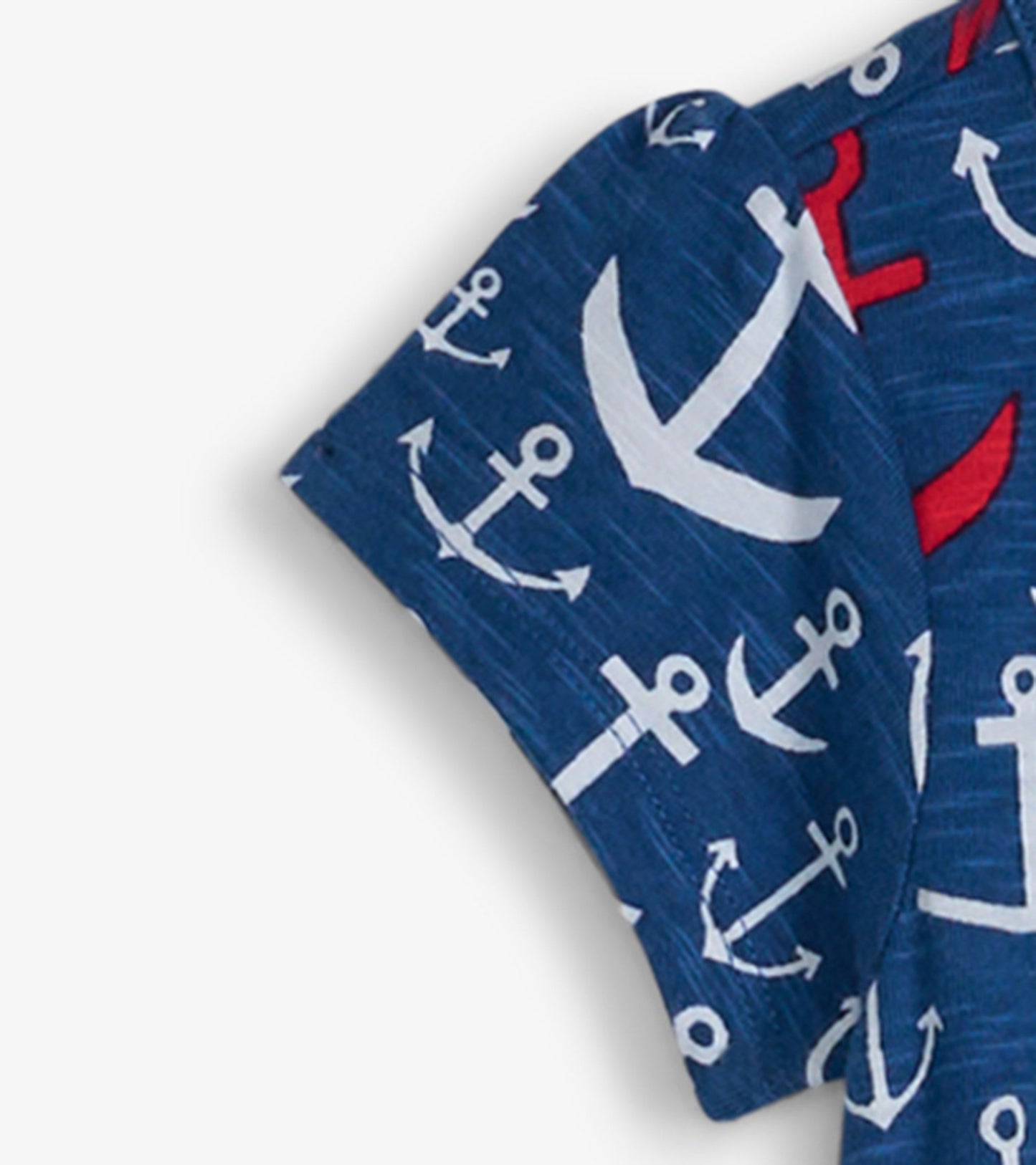 Navy t-shirt dress featuring a stacked anchor pattern in white and red, short sleeves, and a relaxed fit.