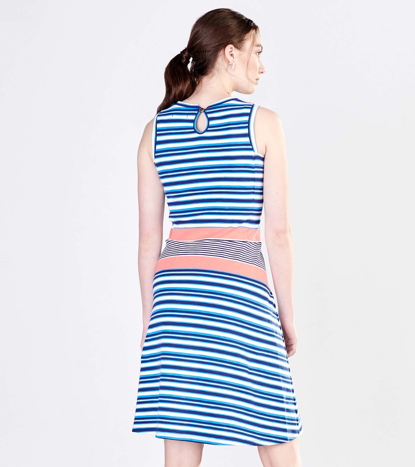 Sleeveless dress featuring blue and white stripes with a coral waistband and a keyhole back detail.