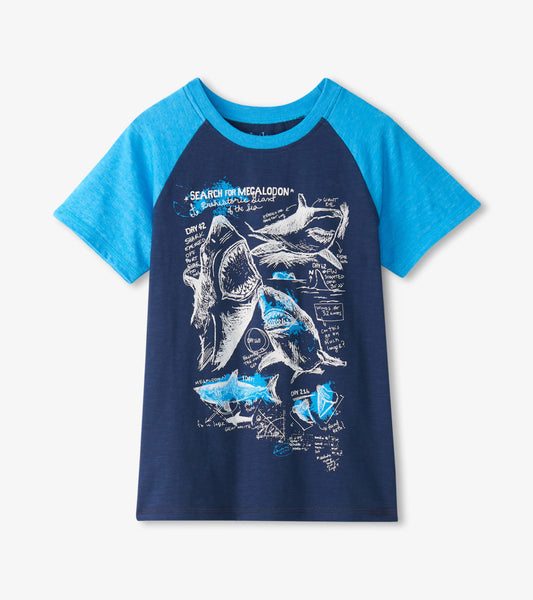 Navy blue raglan t-shirt with light blue sleeves featuring shark graphics and text illustrations.