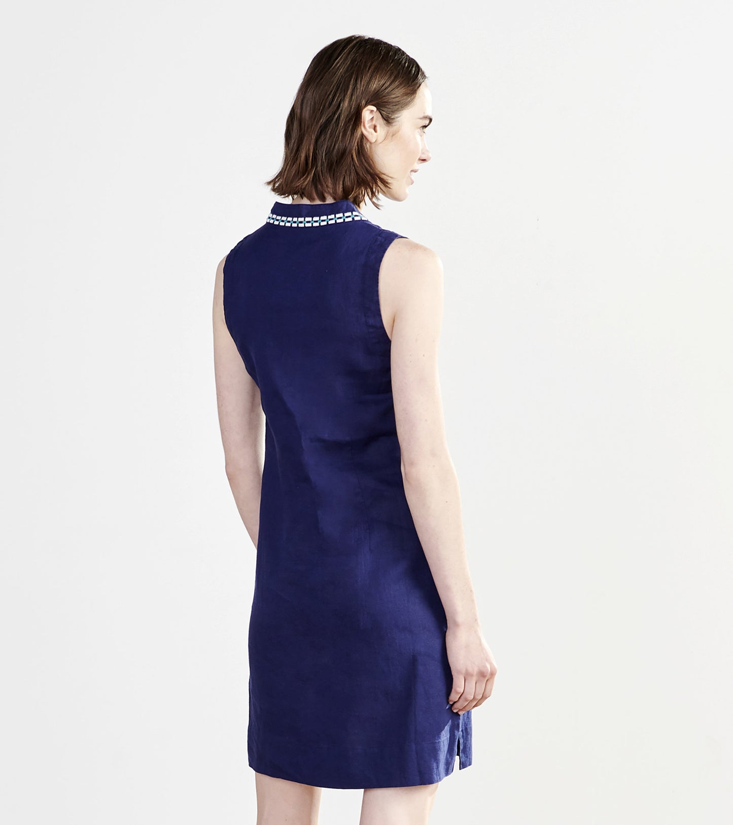 Sleeveless shift dress in patriot blue with a decorative collar, featuring a relaxed fit and side slits.