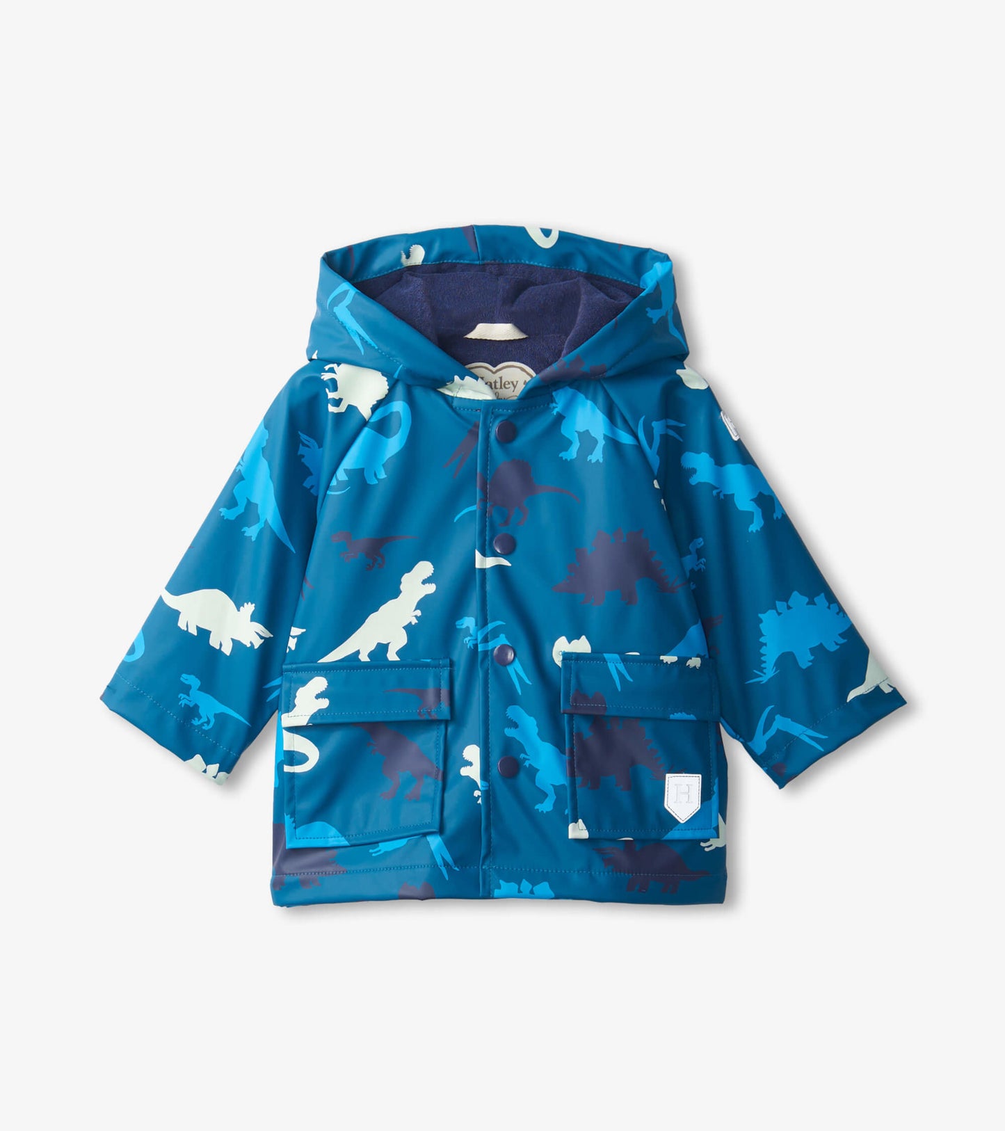 Blue dinosaur-patterned raincoat with a hood and front pockets, designed for babies.