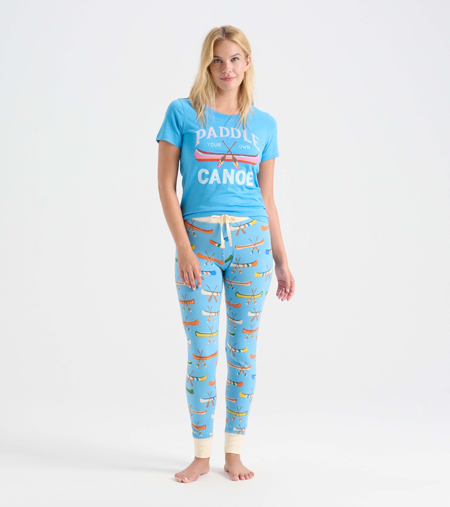 Light blue pajama t-shirt with "Paddle Your Own Canoe" print, paired with matching patterned leggings featuring canoes.