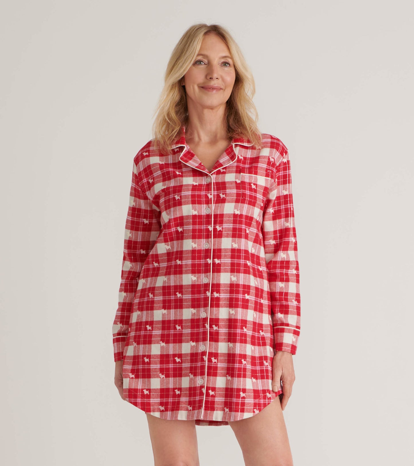 Red plaid flannel nightgown with long sleeves, button front, and playful dog print. Suitable for cozy lounging.