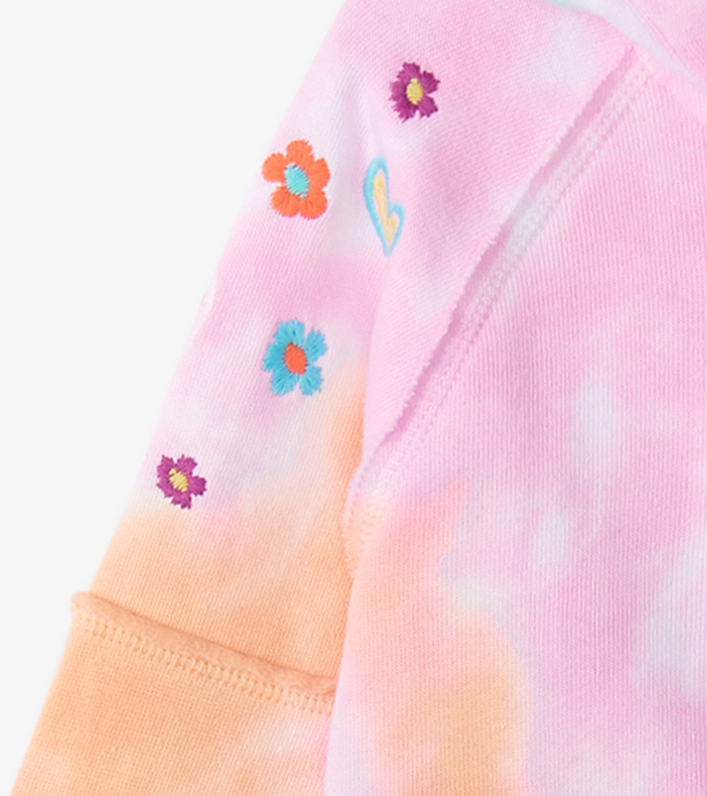 Pink and orange tie-dye hoodie featuring colorful floral embroidery on the sleeves. Soft fabric, casual style.