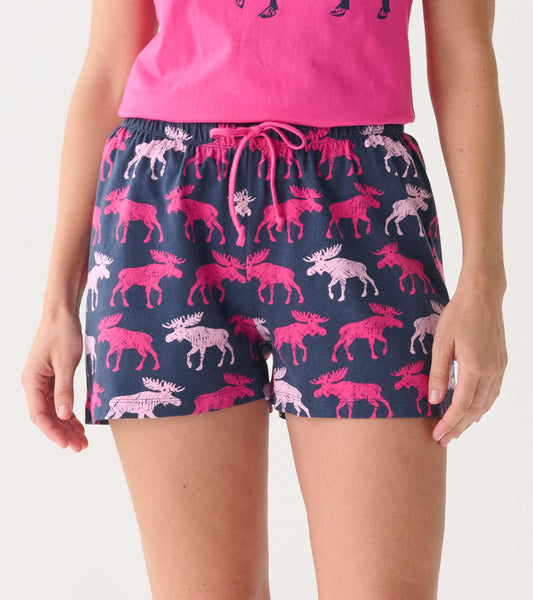 Navy cotton sleep shorts featuring a playful moose pattern in pink and white, with an elastic waistband and drawstring.