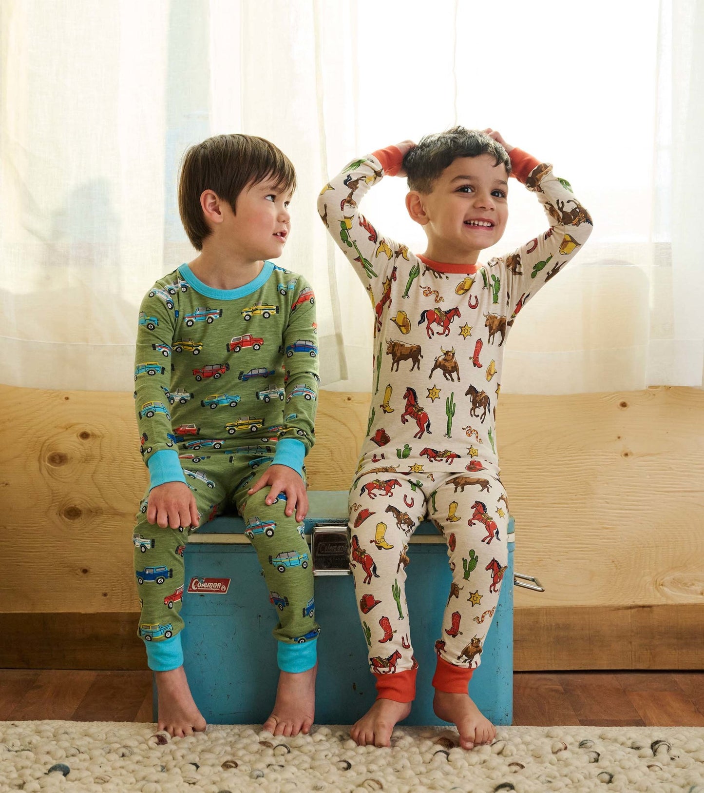 Boys' vintage rodeo pajama set featuring colorful truck and cowboy prints, made from soft fabric, ideal for sleepwear.