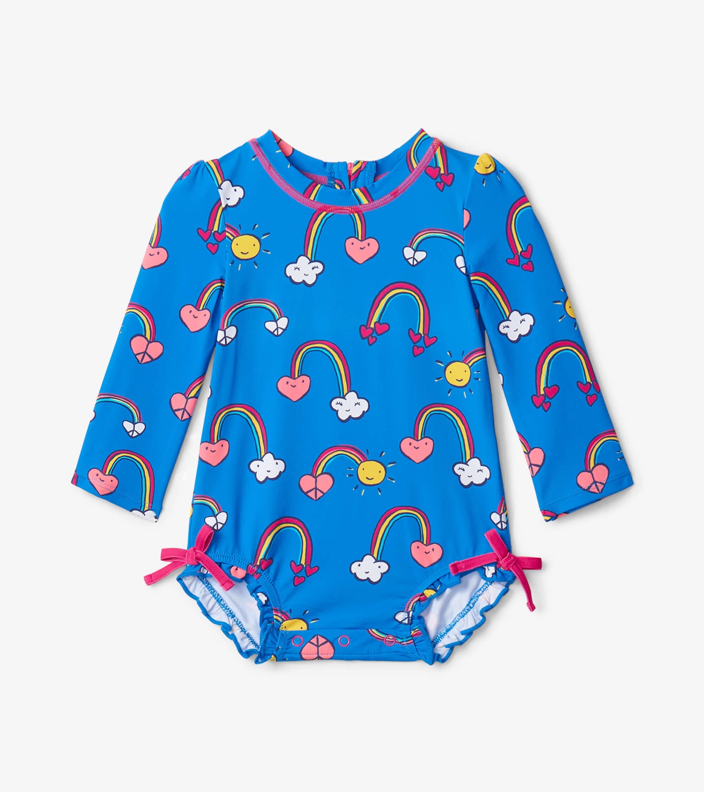 Blue long-sleeve baby rashguard swimsuit with rainbow, sun, heart, and cloud patterns; features pink bow ties at the sides.