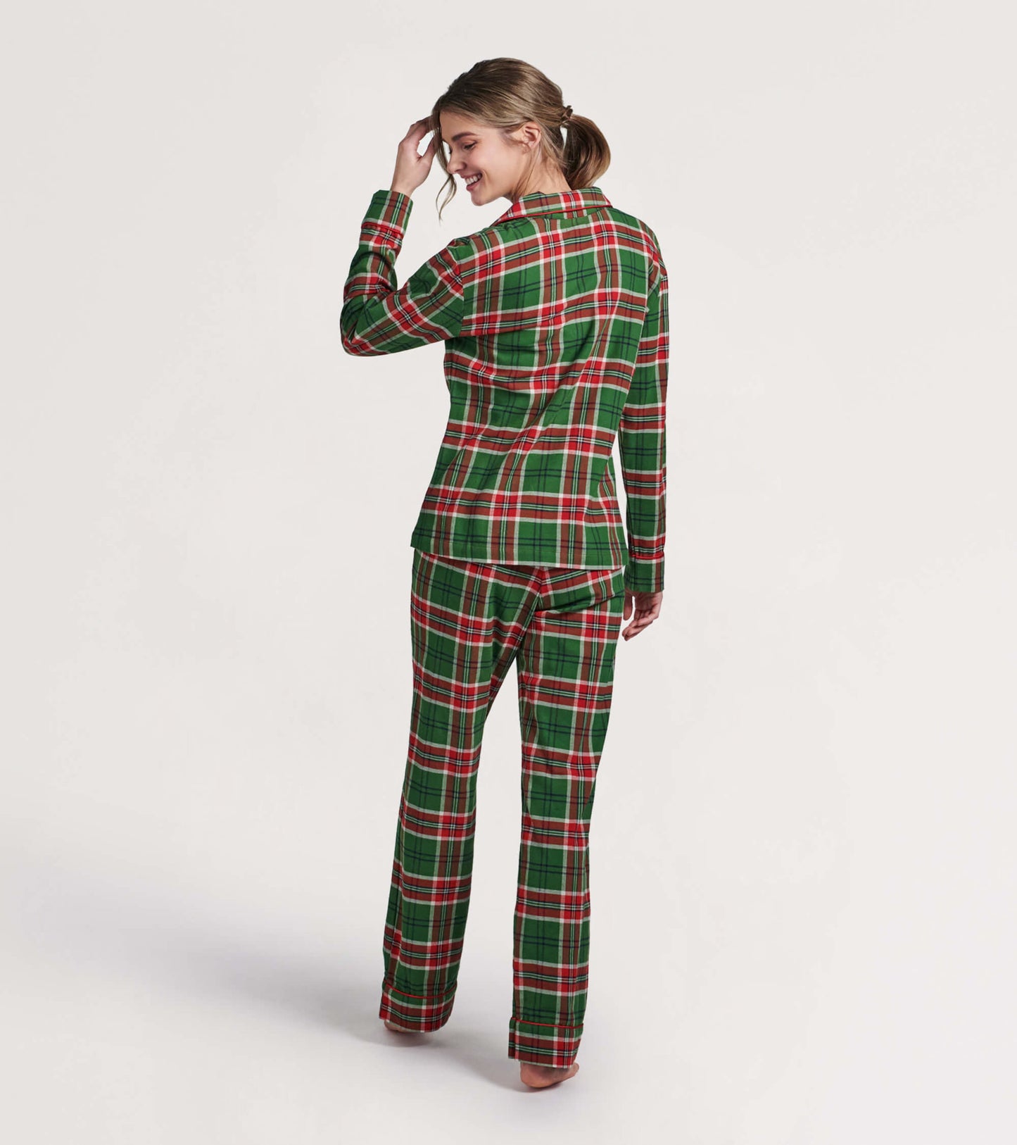 Green and red plaid flannel pajama set featuring a button-up top and matching pants, shown from the back.