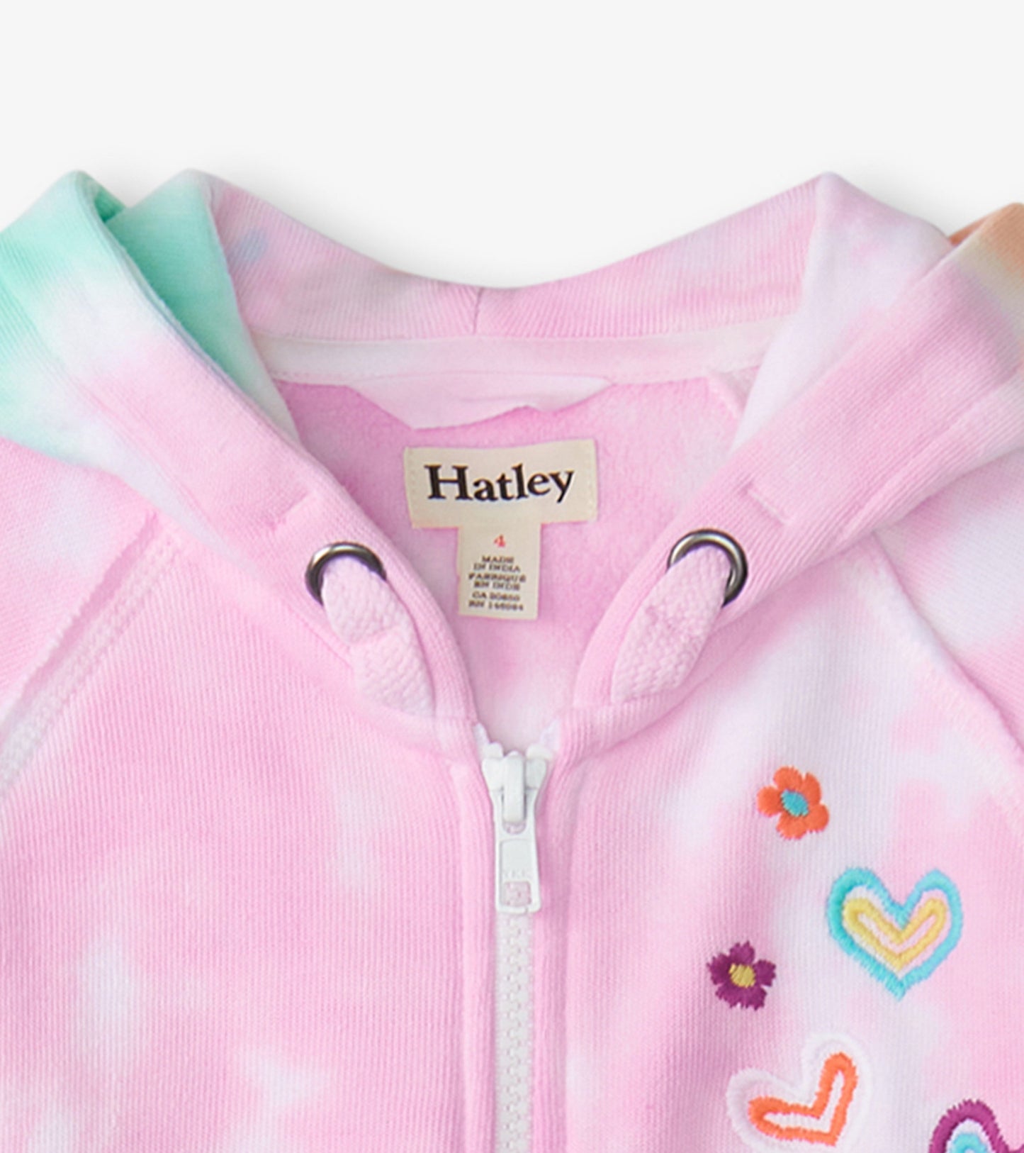 Pink tie-dye hoodie with a zip front, featuring colorful embroidered flowers and hearts on the chest.