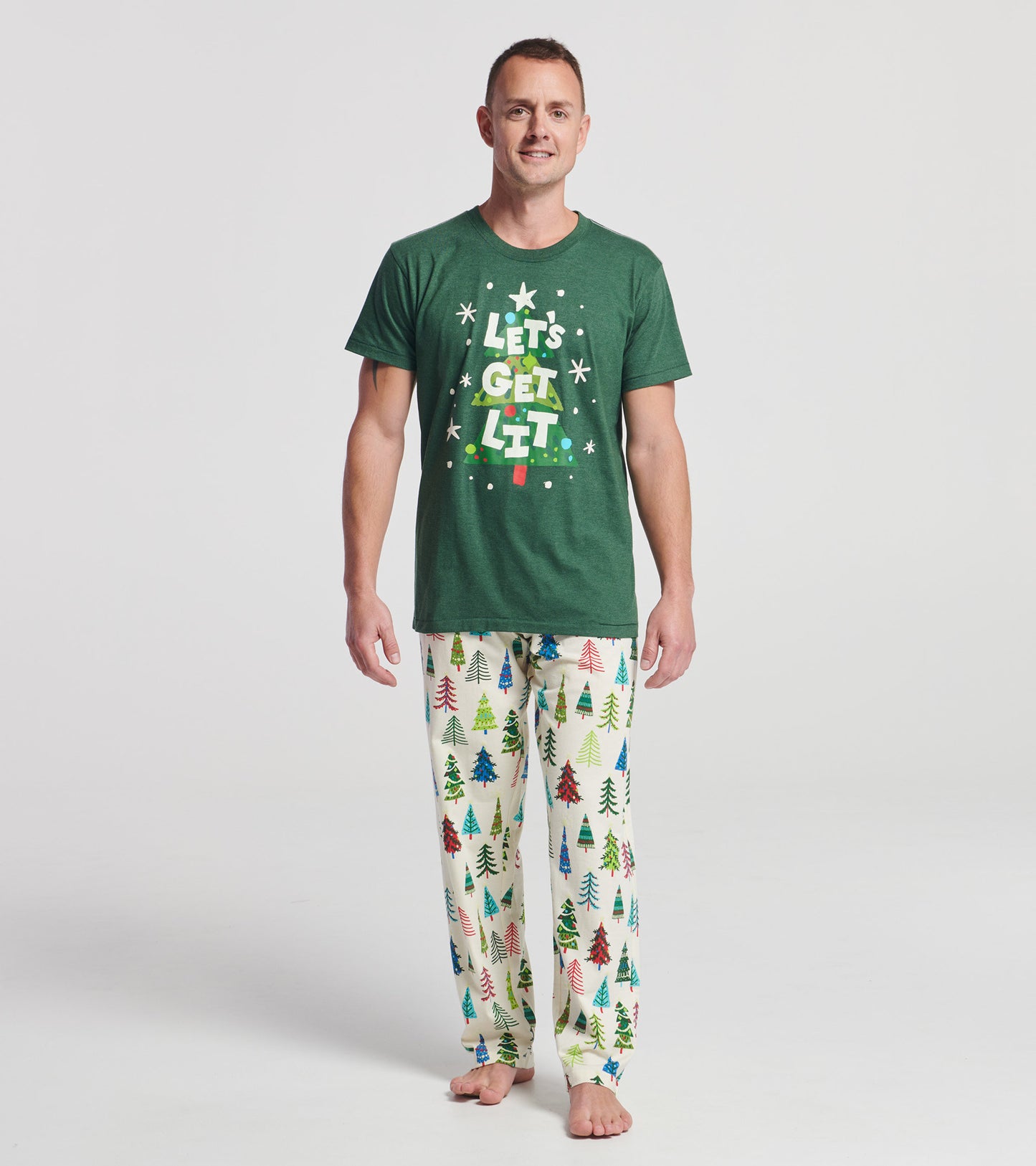 Men's pajama pants in cream with colorful Christmas tree patterns, made of stretch cotton for comfort.