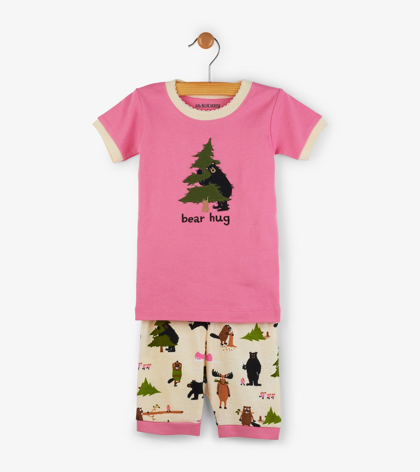 Pink short pajama set featuring a bear graphic on the top and playful animal patterns on the shorts.