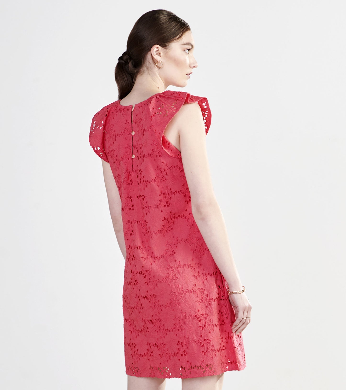 Rouge red eyelet dress featuring flutter sleeves and a button closure at the back, perfect for casual outings.