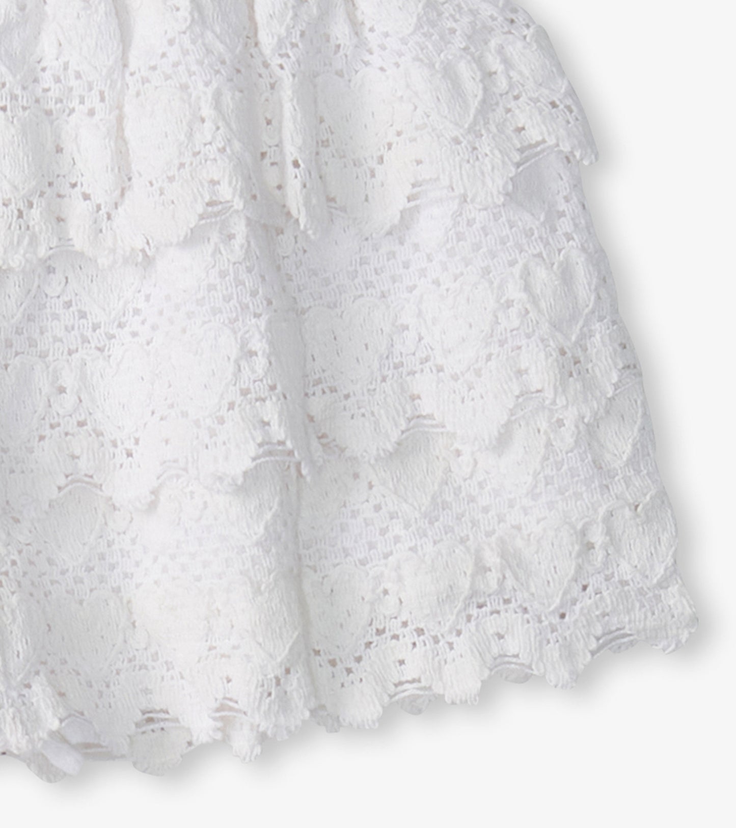 White skort featuring a floaty design with heart-shaped patterns, ideal for casual wear.