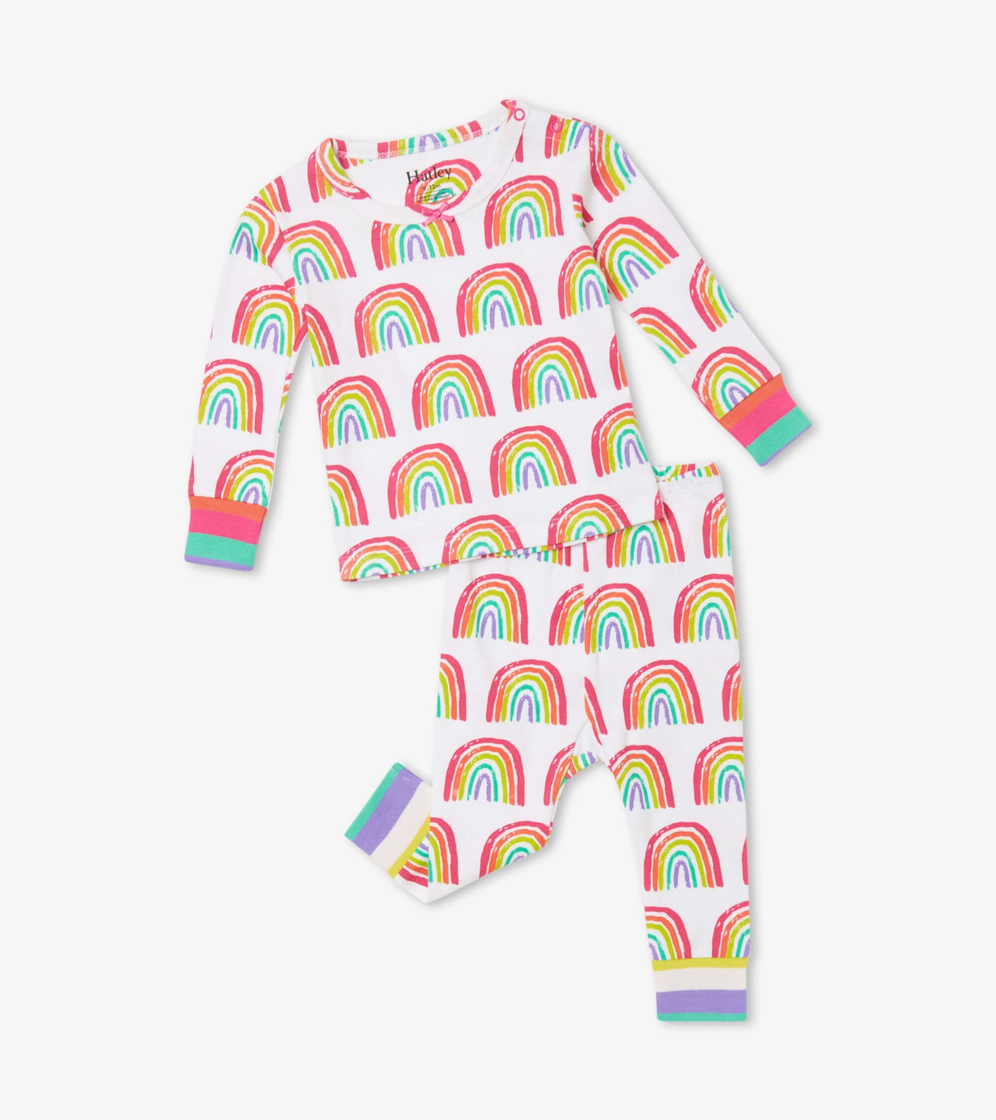 Organic cotton baby pajama set featuring a colorful rainbow pattern on a white background, with contrasting cuffs.