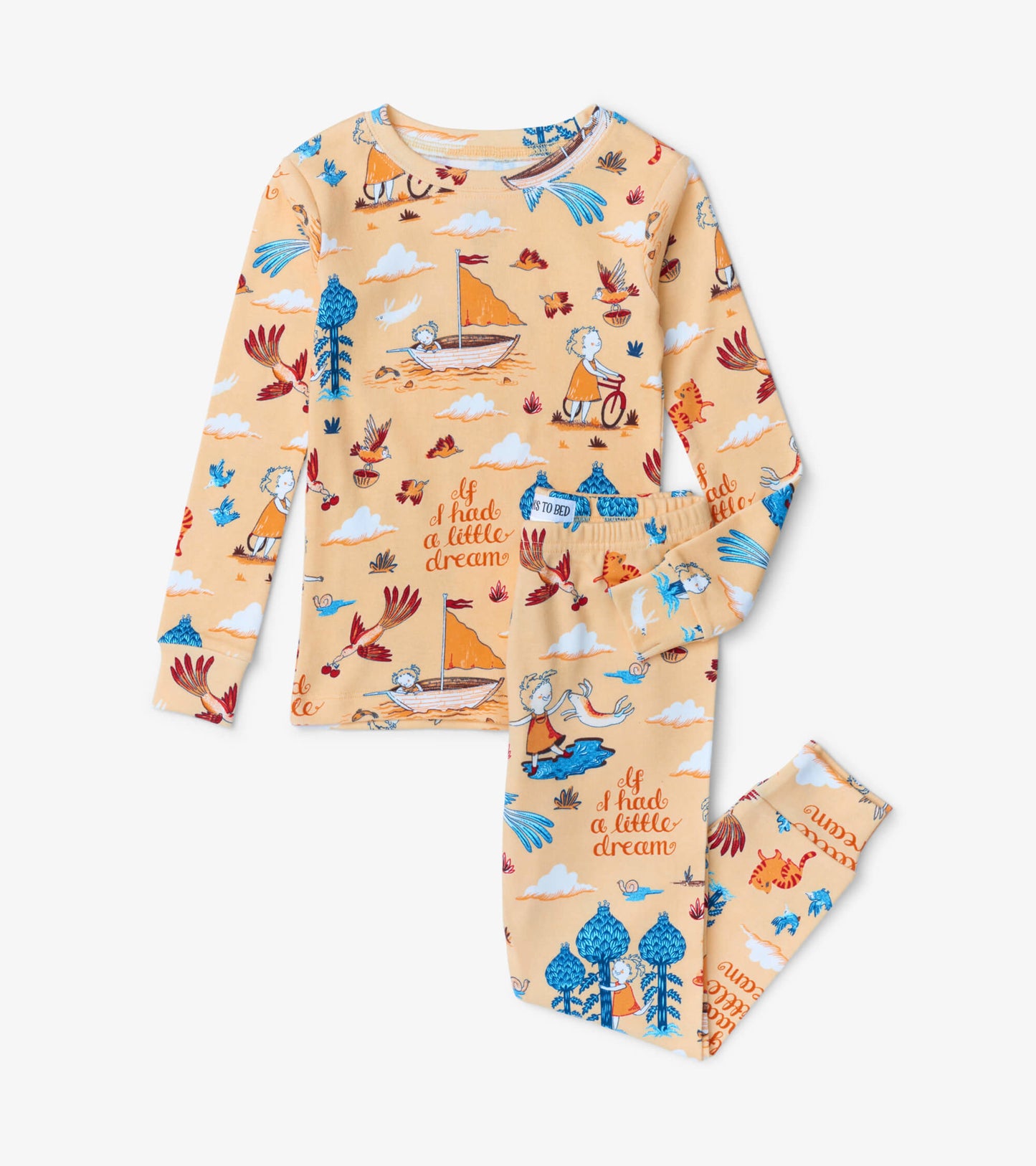 Peach-colored pajama set featuring whimsical illustrations of children, boats, and animals on a soft fabric.